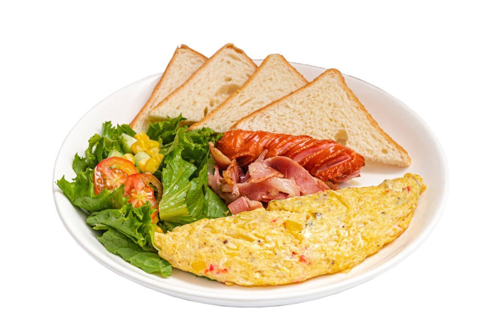 British Classic Breakfast with omelete, sausage, bacon, salad and sandwiches