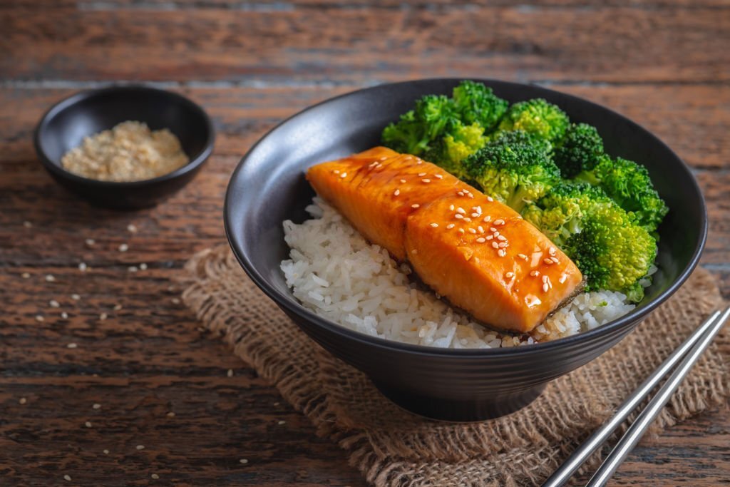 Salmon teriyaki with rice and vegetable in bowl