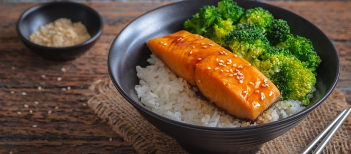 Salmon teriyaki with rice and vegetable in bowl